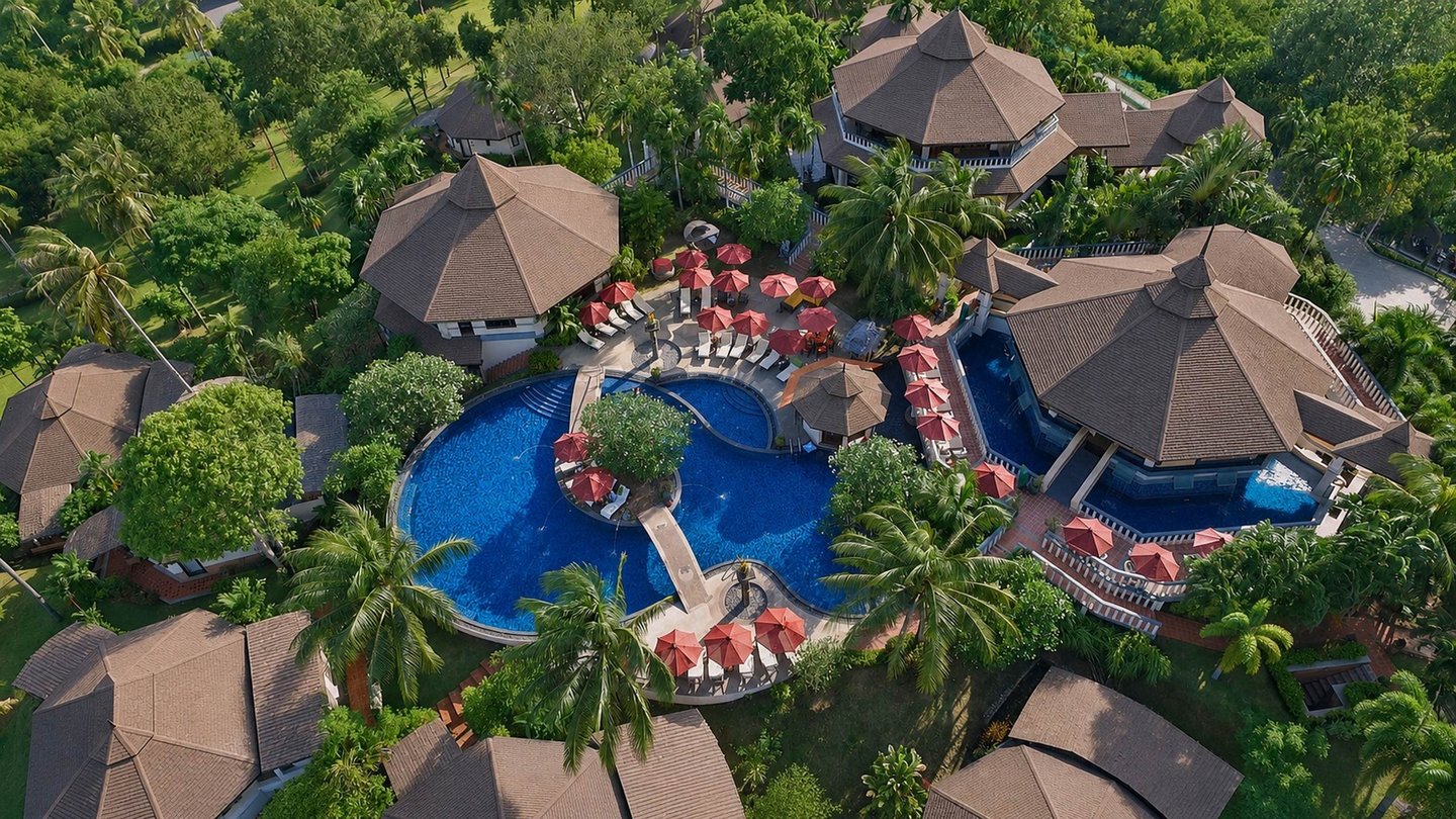 Aerial view of the pool and tropical gardens at Mangosteen Ayurveda and Wellness Resort